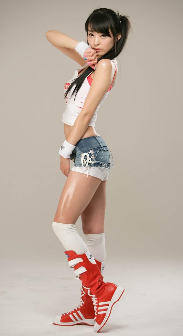 Brunette Race Queen with Bare Legs wearing Blue Denim Shorts and Red Boots